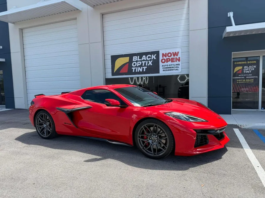 Red Corvette Z06 outside Black Optix Tint Doral