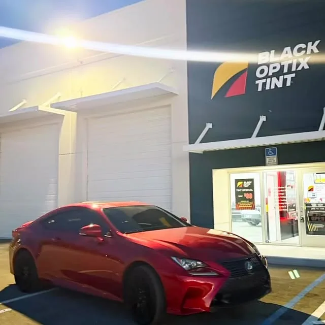 Red Lexus RC with fresh ceramic tint outside the Doral shop
